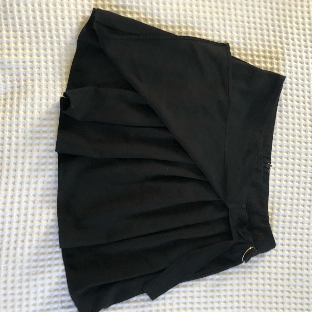 Black mini skirt with pleat and buckle detail